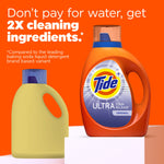 Tide Ultra Stain Release bottle on a platform next to a generic yellow bottle silhouette with text about '2X cleaning ingredients'.