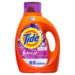 Front-facing Tide Ultra Febreze liquid detergent bottle with purple cap and floral label showing 65 loads