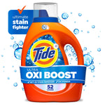 Close-up product shot of an orange Tide Ultra Oxi Boost liquid detergent bottle with blue label and water-bubble graphics.