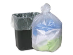 Tied translucent garbage bag filled with mixed items positioned beside a black rectangular trash can