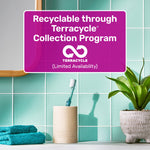 Toothbrush in a holder on a tiled bathroom counter with overlay stating recyclable through Terracycle collection program
