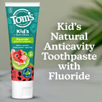 Tom’s of Maine Kid’s fluoride toothpaste tube beside text reading Kid’s Natural Anticavity Toothpaste with Fluoride