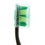 Toothbrush head covered by a transparent mint-colored protective cap showing green bristles underneath