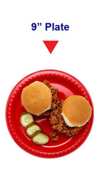 Top-down view of a red plastic plate holding two small sandwiches and pickle slices with '9" Plate' text above