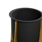 Top-quarter view of a black metal planter in a gold textured stand showing the rim and inner cavity of the pot.