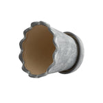 Top-down view of a gray ceramic planter showing scalloped wavy rim and unglazed interior