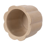Top-down view into tan scalloped ceramic planter showing smooth glazed interior and flower-shaped rim.