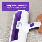Hand holding BLACK+DECKER pet hair remover showing transparent window and purple product accents