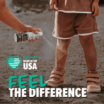 Hand spraying Trek kids insect repellent near a child's legs on a sandy surface with 'Feel the Difference' text