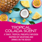 Top-down tropical arrangement with pineapple, coconut and passionfruit over blue wood
