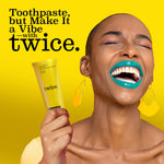 Smiling person holding a yellow Twice toothpaste tube against a bold yellow background with brand slogan text.