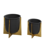 Two black planters with removable gold crisscross stands shown side by side on white background, front-facing view.