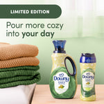 Two Downy Cozy Collection pistachio cream products shown with folded towels and text reading pour more cozy into your day