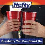 Two hands toasting with red Hefty party cups, Hefty logo and durability message banner visible