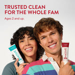 Two smiling people holding Native toothpaste tubes with headline 'Trusted clean for the whole fam' above them