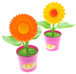 Two pink toy flower pots each with a large plastic sunflower and green leaves, shown on a white background.