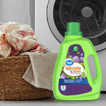 Great Value Ultimate Fresh detergent bottle placed in front of a washing machine and laundry basket scene