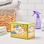Lifestyle shot of Great Value Ultimate Fresh dryer sheets box on a counter next to folded towels, wicker basket and spray bottle
