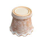Underside view of a terracotta planter showing base ring and scalloped edge, whitewashed finish