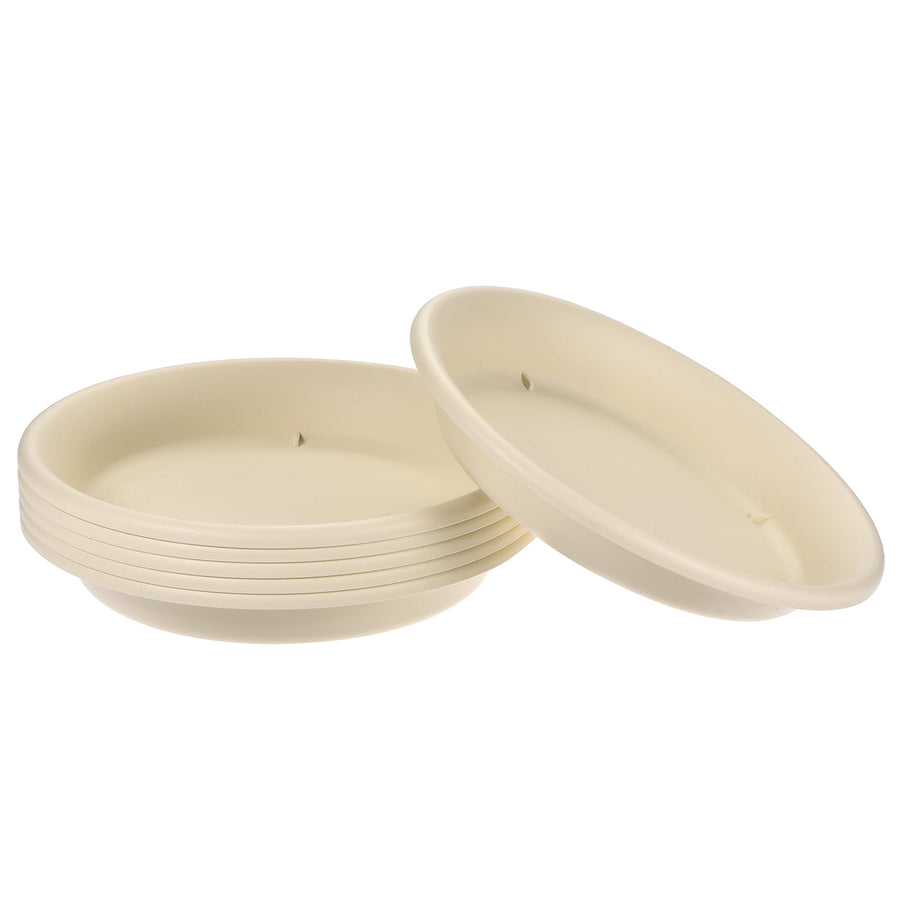 Stack of beige round plastic plant saucers shown on white background, one tilted forward to show depth