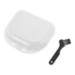 Clear plastic orthodontic retainer/travel case with ventilation holes and a small black cleaning brush on white background