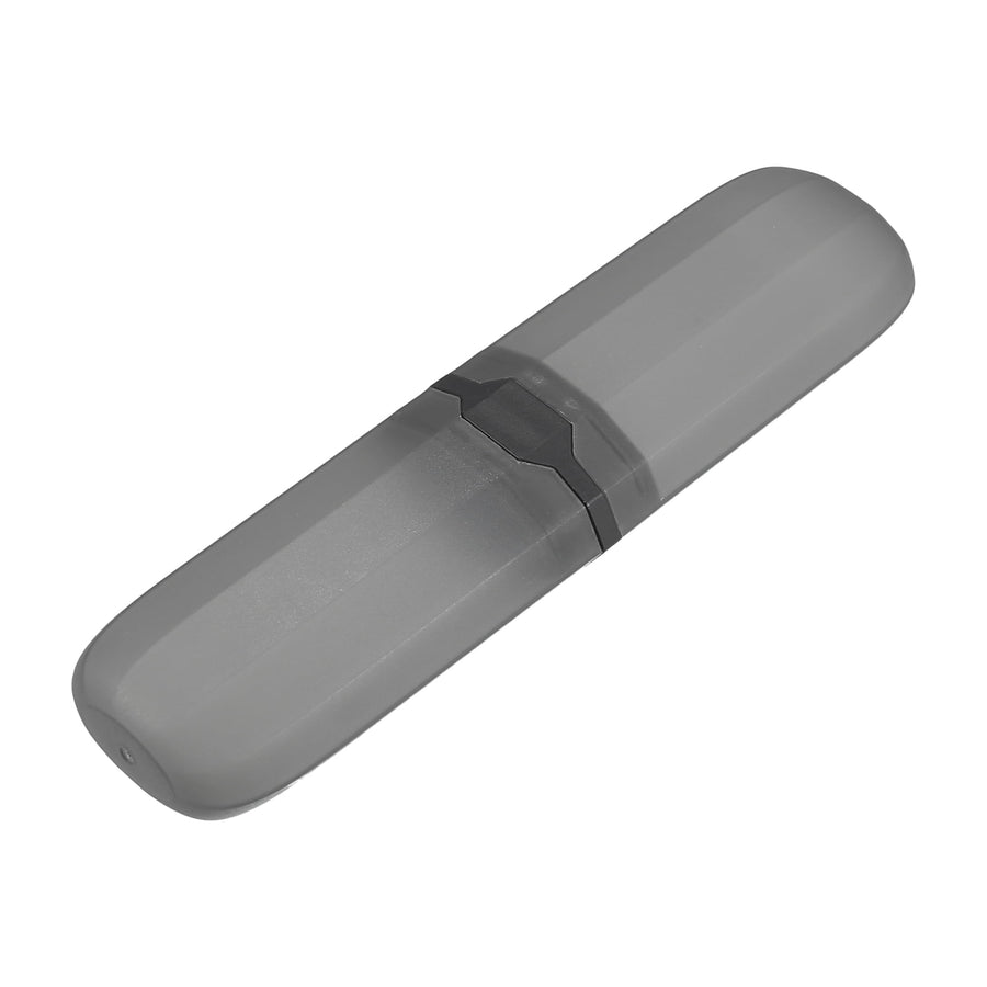 Gray plastic travel toothbrush case with central black latch, shown closed on white background