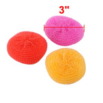 Three round mesh scrubbers in pink, red and yellow with a 3" measurement graphic