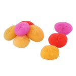 Pile of circular plastic mesh scouring pads in orange, red and pink on white background
