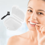 Smiling woman holding a clear dental aligner beside an open clear retainer case and a small black cleaning brush
