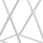 Close-up of white plastic crossed support rods and connector joints of a collapsible trash bag frame.