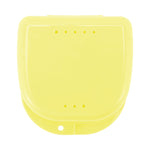 Flat-lay view of a closed yellow plastic retainer or braces case showing ventilation holes and latch tab.