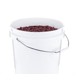 White plastic bucket filled with red beans visible at the top, metal handle across the side