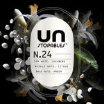 Graphic label showing Unstopables logo and N.24 scent notes (cashmere, citrus, amber) with white beads and flowers