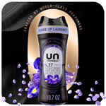 Black Unstopables N.37 scent booster bottle with purple floral accents and scattered scent beads on a dark luxe background.