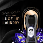 Promotional artwork showing Unstopables N.37 bottle with text 'Luxe Up Laundry' and purple flower petals on a black background.
