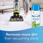 Carpet-cleaning scene showing an upright vacuum in use and a Febreze Heavy Traffic Carpet Foam can placed to the right with text about removing dirt.