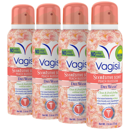 Four Vagisil Scentsitive Scents Peach Blossom dry wash spray cans arranged in a row