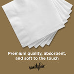 Close-up of several Vanity Fair white napkins fanned with text reading 'Premium quality, absorbent, and soft to the touch'