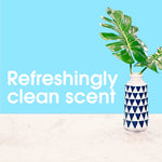 Decorative vase with green leaves on a marble surface and large text reading ‘Refreshingly clean scent’ on blue background