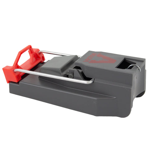 Close-up angled photo of a grey Victor quick-kill snap mouse trap with red trigger and metal spring bar.