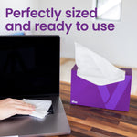 Open purple Viva box on a wooden surface next to a laptop, white sheet ready for use, text about being perfectly sized
