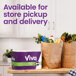 Viva paper towel pack placed on a kitchen counter beside grocery bags with text about store pickup and delivery