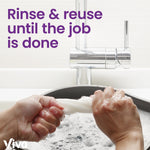 Close-up of hands rinsing a reusable towel under a faucet with text encouraging rinsing and reusing