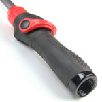 Foam-grip handle and threaded hose connector of a red-and-black telescoping watering wand