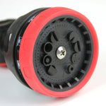 Close-up of the watering wand nozzle face showing multiple spray openings and red outer ring