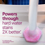 Toilet wand scrubbing a bowl with pink foam and text claiming it powers through hard water stains