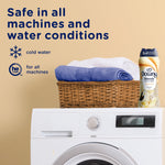 Laundry scene with a front-load washer, a basket of folded towels and a Downy Blends Toasted Vanilla bottle plus copy about machine safety