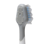 Back view of a Waterpik brush head showing a rubber cheek/brush-cleaning pad and white-blue bristles.