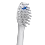 Close-up of a Waterpik white replacement brush head showing dense angled bristles and a blue indicator ring.