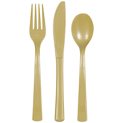 Three gold disposable plastic utensils - fork, serrated knife and spoon on white background.